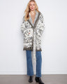 Elegant shawl collar coat with intricate patterns and textures, perfect for a cozy yet stylish look by Charlie B.