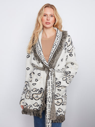 Chic self-tie belt adds a flattering silhouette to this beautifully designed coat by Charlie B.