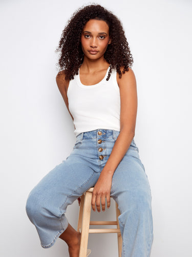 Light blue denim pants with five pockets and cropped length, offering both fashion and function by Charlie B.