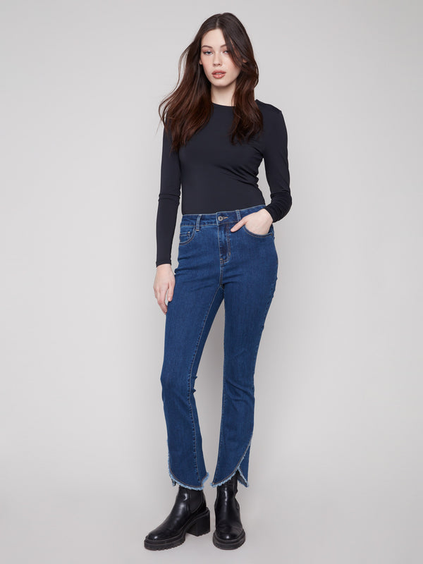 Indigo jeans featuring a stylish bootcut fit and chic frayed hem detail, perfect for any casual outing by Charlie B.