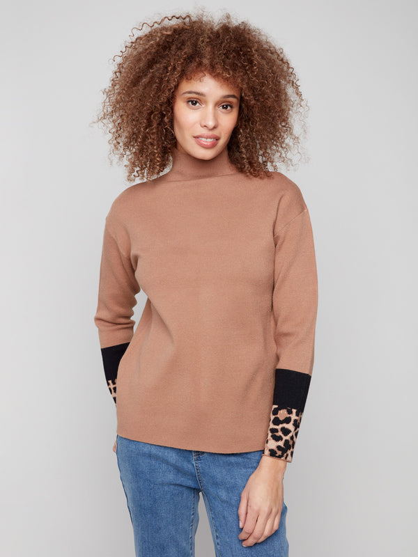 Brown funnel sweater with color-block animal print sleeves, offering a chic and modern look by Charlie B.