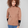 Brown funnel sweater with color-block animal print sleeves, offering a chic and modern look by Charlie B.