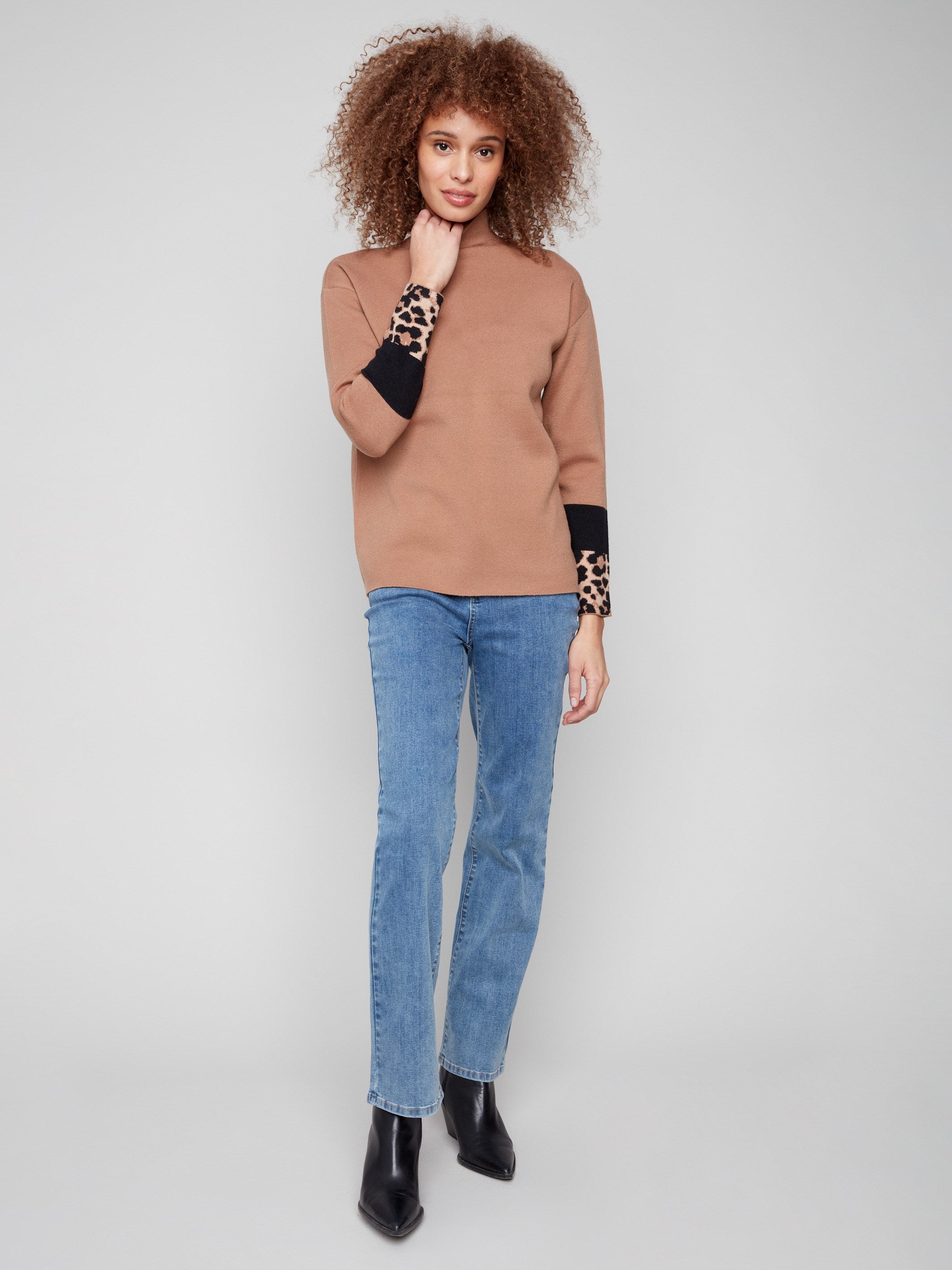 Stylish brown sweater featuring a funnel neck and long sleeves for a cozy feel by Charlie B.