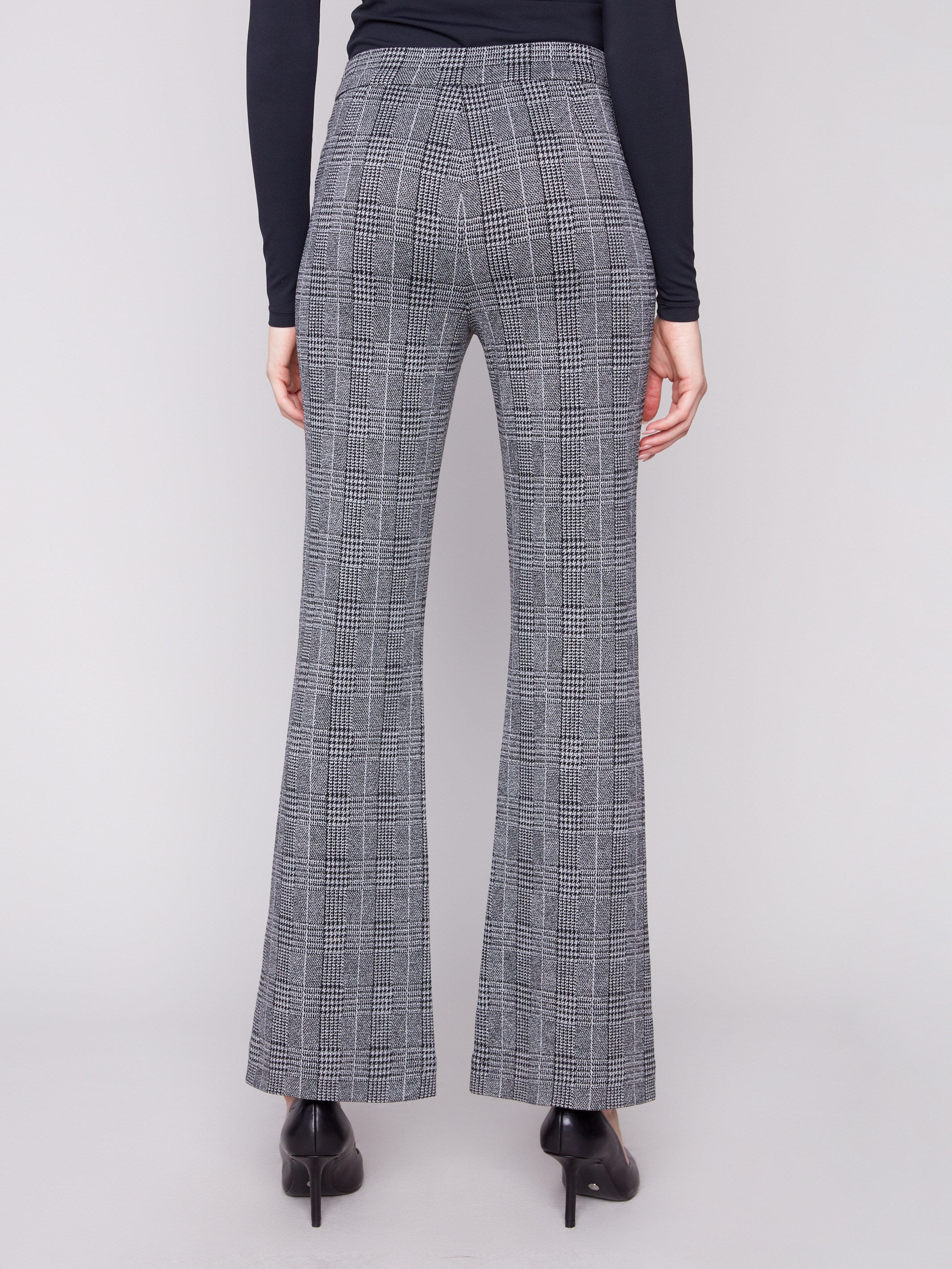 Crafted from stretch fabric, these charcoal plaid pants ensure ease of movement and style by Charlie B.