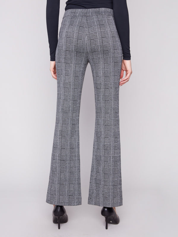 Crafted from stretch fabric, these charcoal plaid pants ensure ease of movement and style by Charlie B.