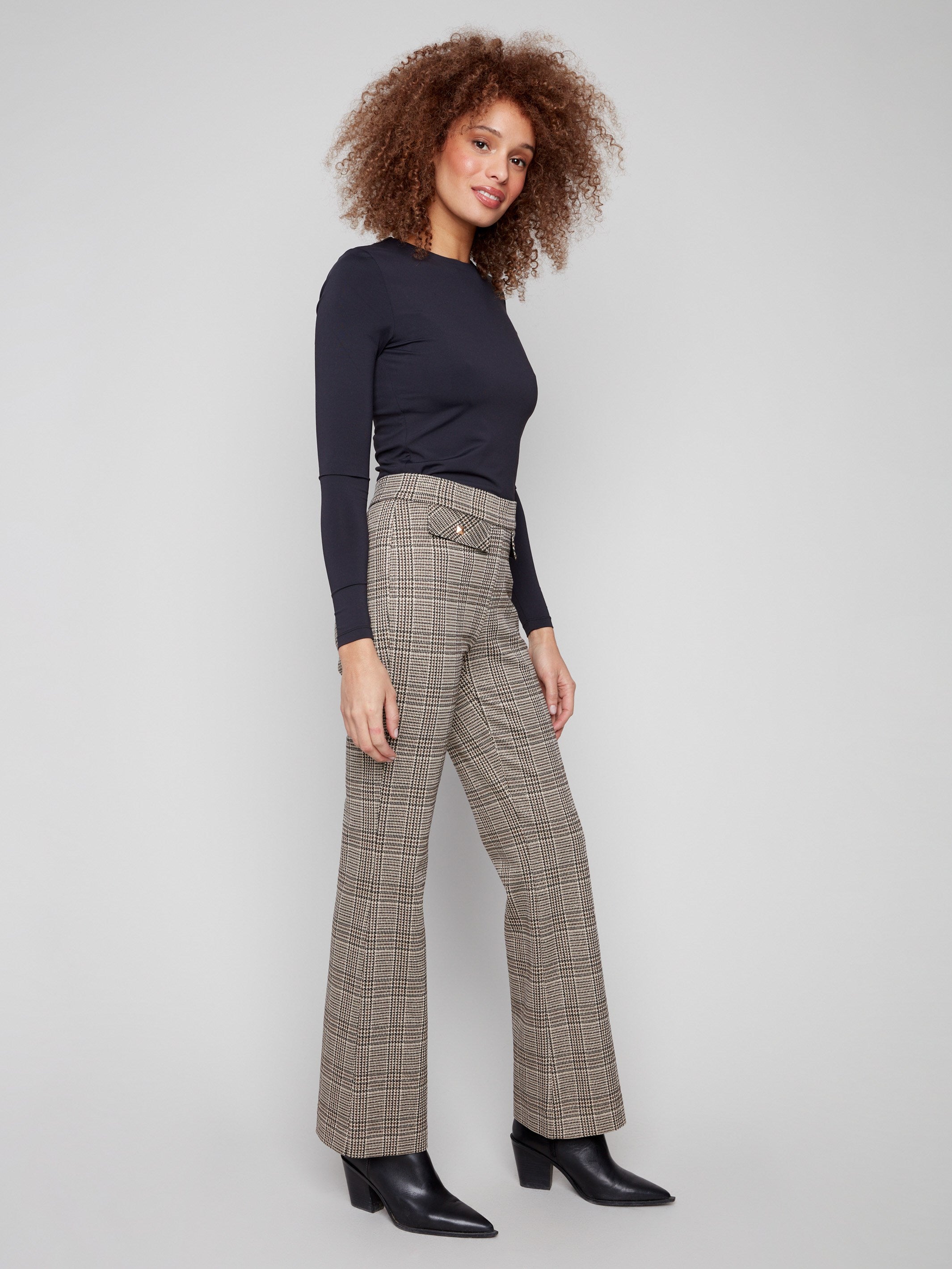 Experience the luxurious feel of Lurex thread in these classic plaid flare pants by Charlie B.