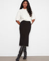 The midi length of this skirt adds a touch of sophistication to your wardrobe essentials. By Charlie B.