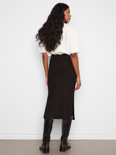 Side slits enhance the design, allowing for ease of movement and added flair. By Charlie B.