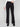 Long length black pants styled elegantly with a white top by Charlie B.