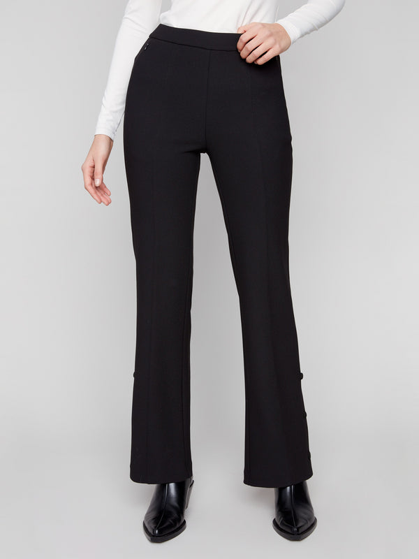 Long length black pants styled elegantly with a white top by Charlie B.