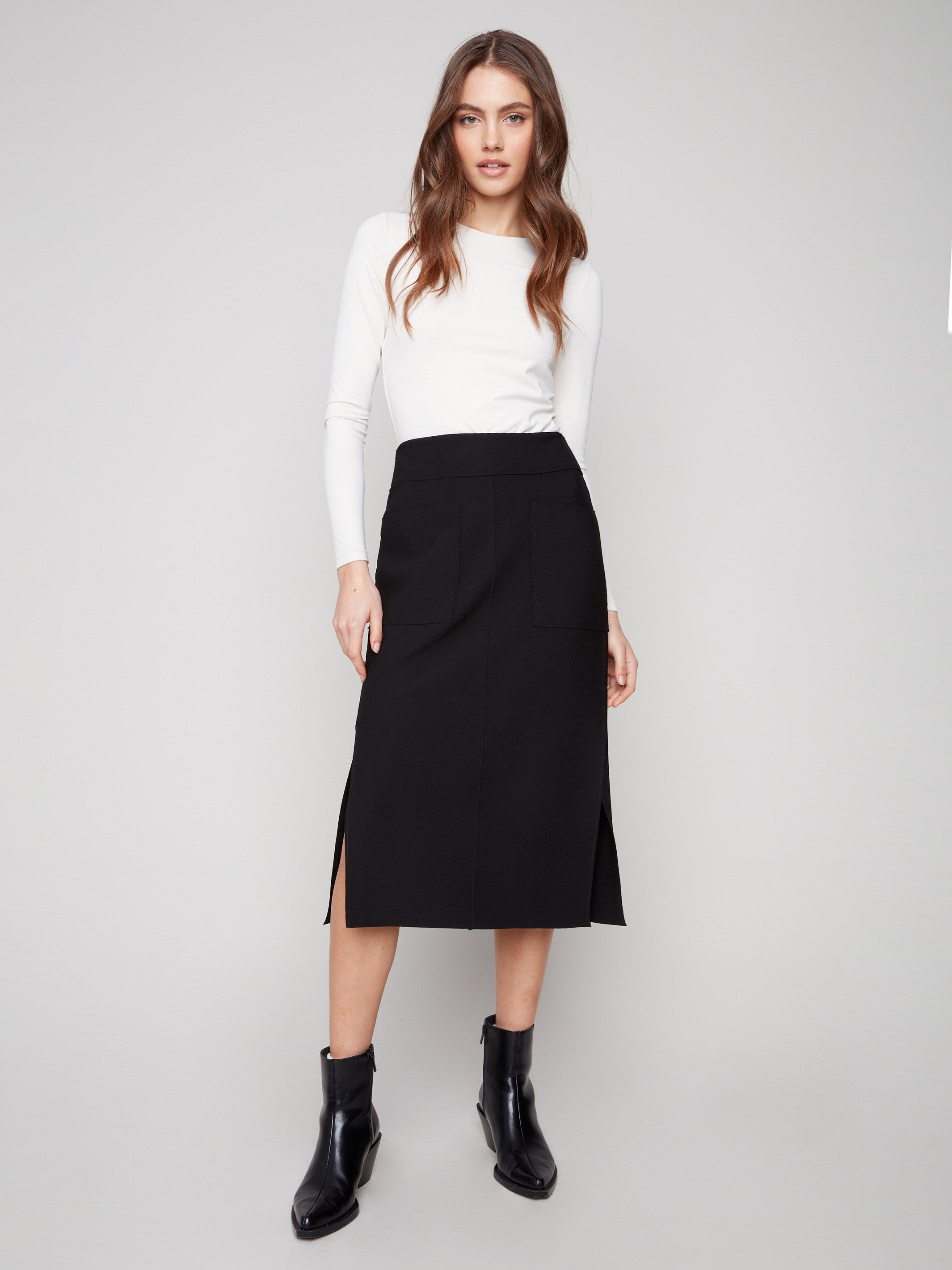 Black crepe skirt with a midi length and stylish stretch fabric by Charlie B, offering comfort and sophistication.