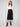Black crepe skirt with a midi length and stylish stretch fabric by Charlie B, offering comfort and sophistication.