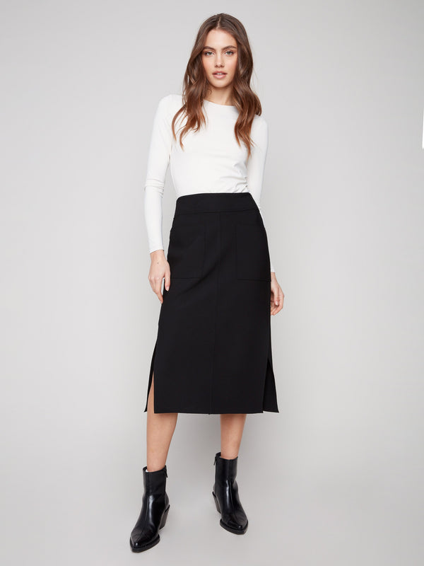 Black crepe skirt with a midi length and stylish stretch fabric by Charlie B, offering comfort and sophistication.