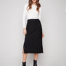 Black crepe skirt with a midi length and stylish stretch fabric by Charlie B, offering comfort and sophistication.