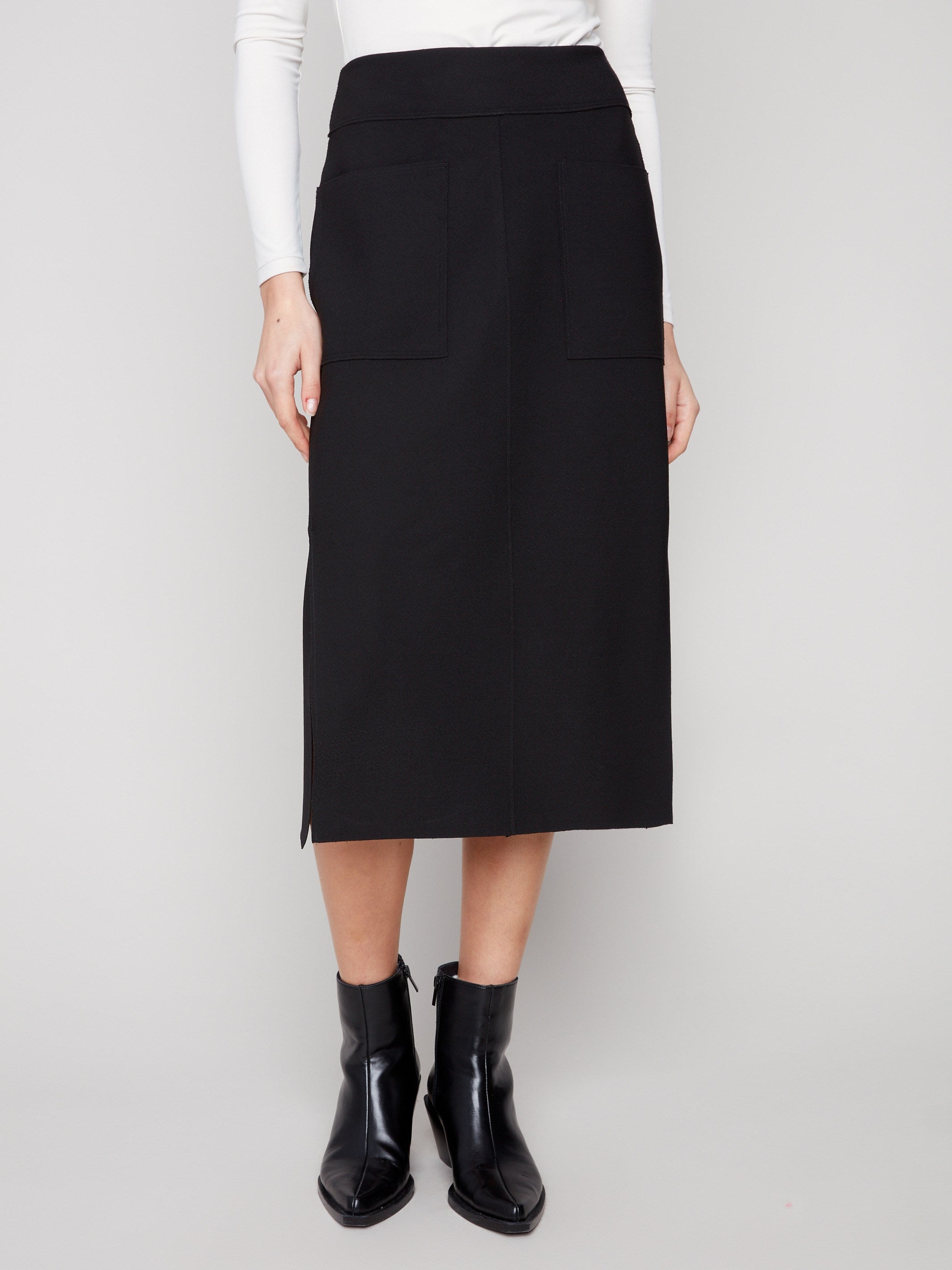 Elegant black skirt featuring front patch pockets for added functionality by Charlie B, perfect for any occasion.
