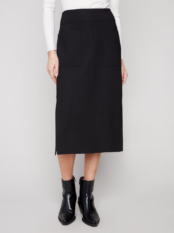 Elegant black skirt featuring front patch pockets for added functionality by Charlie B, perfect for any occasion.