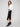 Chic black crepe skirt with side slits for a modern touch by Charlie B, combining style and ease of movement.