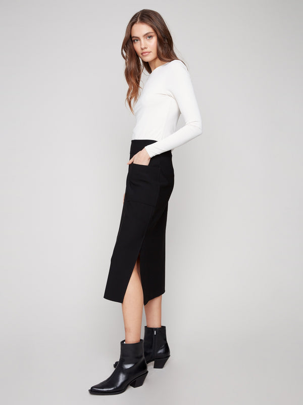 Chic black crepe skirt with side slits for a modern touch by Charlie B, combining style and ease of movement.