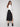 Sophisticated midi-length skirt in black crepe with sleek stretch fabric by Charlie B, ideal for versatile styling.