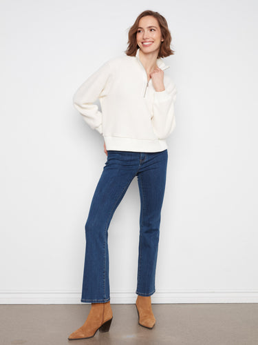 The half-zip closure adds a stylish touch to this relaxed fit sweater by Charlie B.