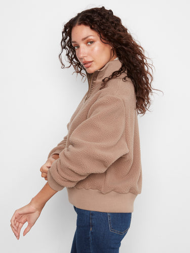 Ribbed hem complements the stand collar on this taupe pullover by Charlie B.