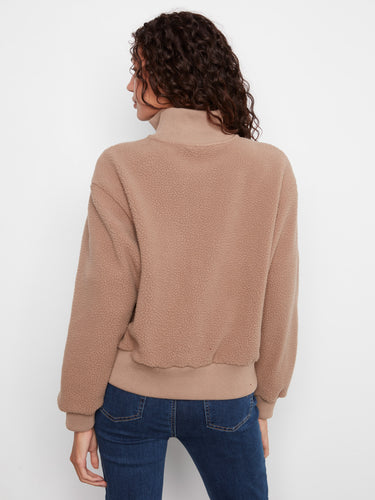 Half-zip taupe pullover featuring ribbed details and relaxed fit by Charlie B.