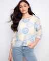 Featuring a crew neckline, this top showcases a beautiful handcrafted crochet design with intricate patterns by Charlie B.