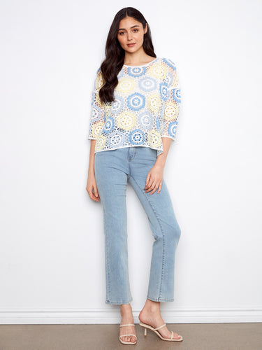 This stylish piece highlights the delicate handcrafted crochet design, perfect for a unique and chic look by Charlie B.