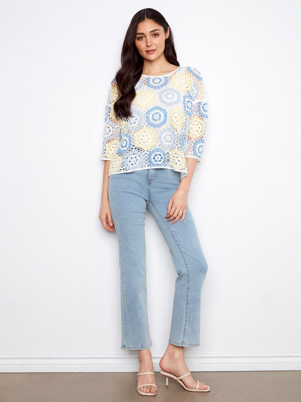 This stylish piece highlights the delicate handcrafted crochet design, perfect for a unique and chic look by Charlie B.