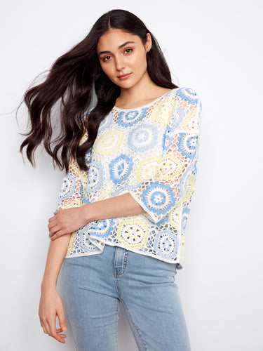 A lovely blend of colors defines this hand crochet top, accentuated by its chic crew neckline and functional 3/4 sleeves. By Charlie B.