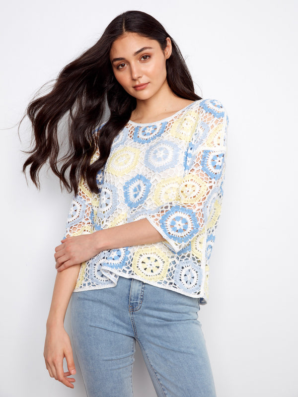 A lovely blend of colors defines this hand crochet top, accentuated by its chic crew neckline and functional 3/4 sleeves. By Charlie B.