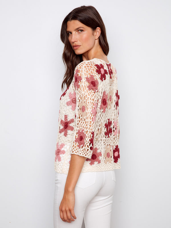 Lovely handcrafted crochet top with unique flower motifs, offering both style and comfort effortlessly by Charlie B.