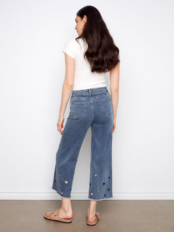 Featuring five pockets, these medium blue wide-leg jeans offer both style and functionality by Charlie B.