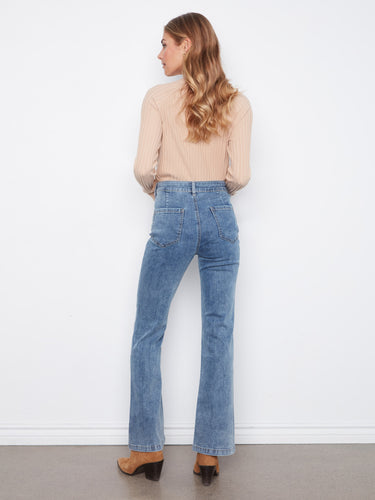 Full-length denim jeans with a regular rise, offering a classic fit that complements any wardrobe. Designed by Charlie B.