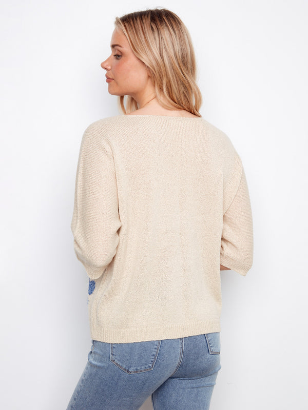 Fashion-forward knitwear featuring a relaxed fit and delicate Lurex threading, providing both comfort and sparkle to your wardrobe by Charlie B.