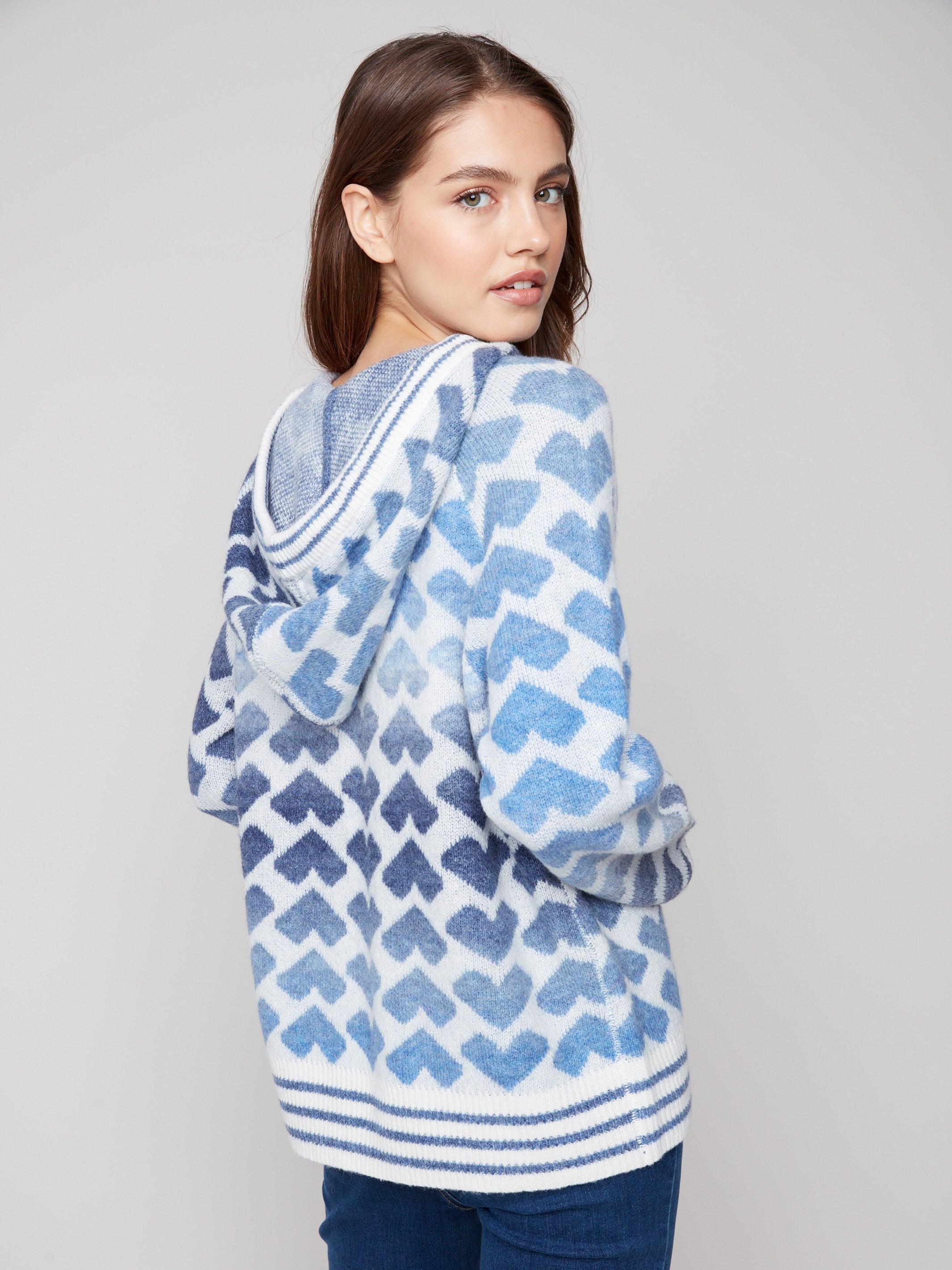 Heart-patterned blue and white sweater designed with comfortable raglan sleeves by Charlie B.