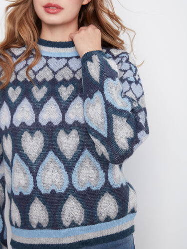 Stylish navy sweater showcasing a charming heart jacquard design by Charlie B.