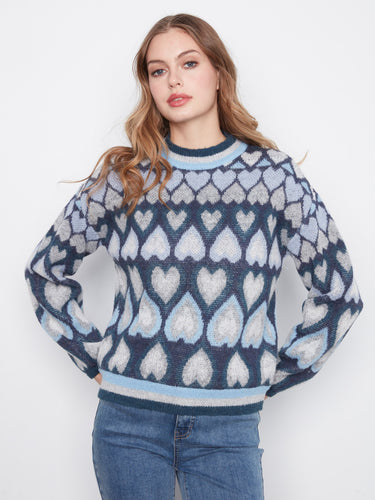 Elegant sweater in blue tones, complete with a mock neck and lovely heart pattern by Charlie B.