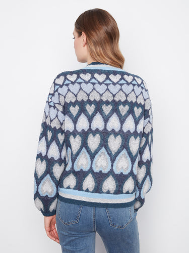 Fashionable blue sweater boasting an intricate jacquard heart motif by Charlie B.