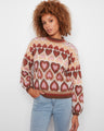 Sweater with a charming jacquard heart pattern, adding a playful touch to any look. Designed by Charlie B.