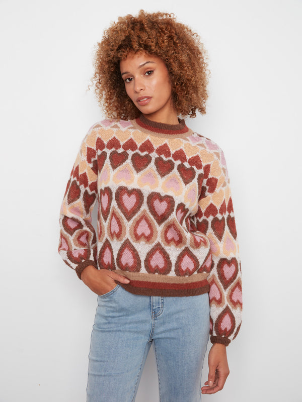 Sweater with a charming jacquard heart pattern, adding a playful touch to any look. Designed by Charlie B.