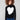 Black sweater adorned with a bold intarsia heart, complemented by ribbed shoulders for added texture by Charlie B.