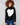 Black sweater adorned with a bold intarsia heart, complemented by ribbed shoulders for added texture by Charlie B.
