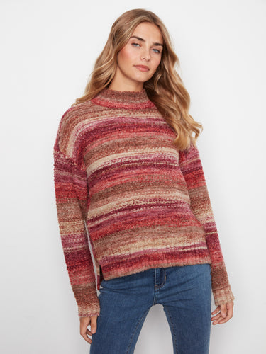 Indulge in the soft texture of this striped sweater, designed to keep you cozy while looking effortlessly chic. By Charlie B.
