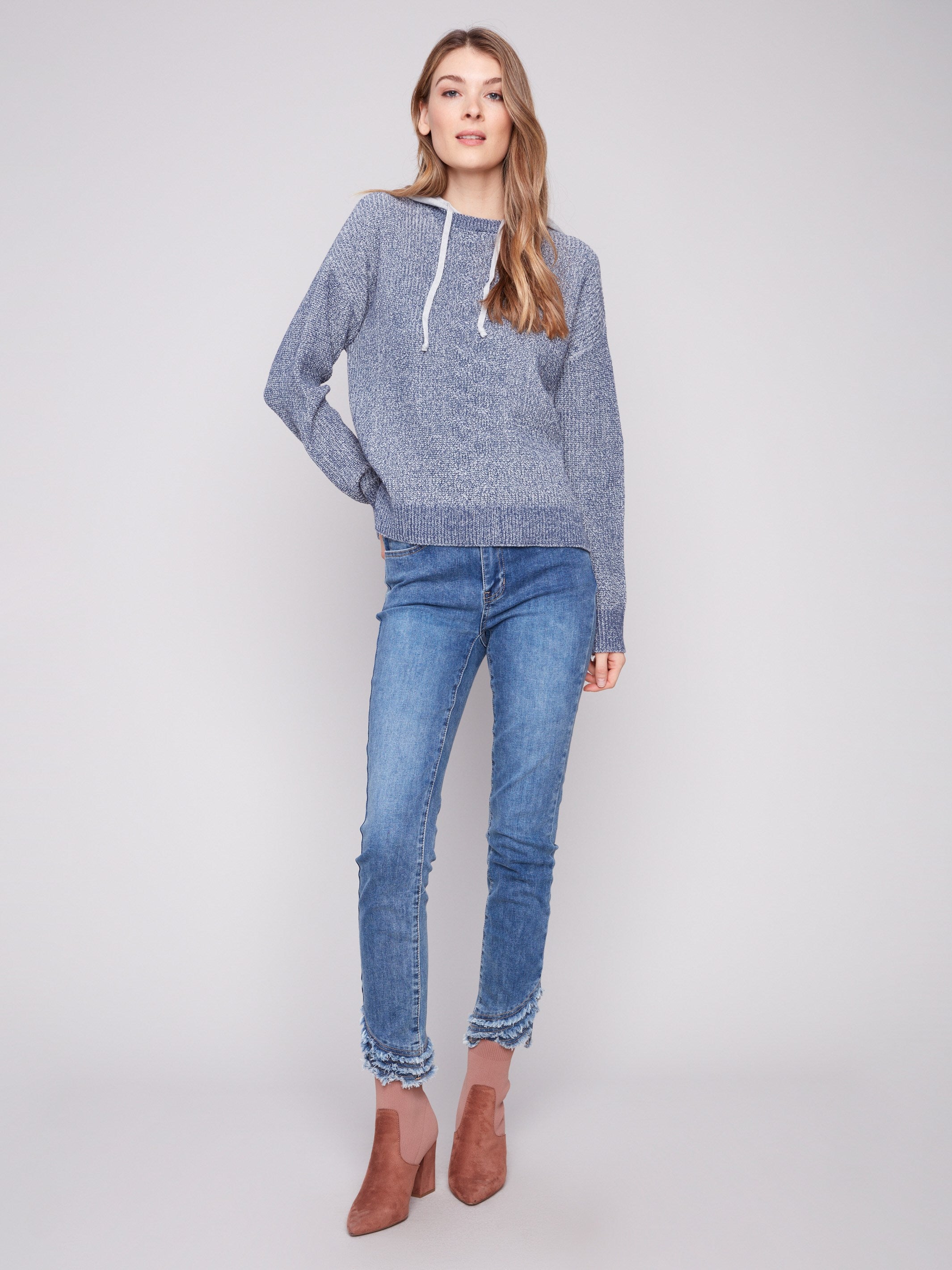 Elegant heather denim sweater showcasing a unique hem slit detail, ideal for layering by Charlie B.