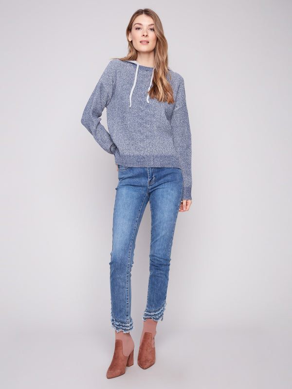 Elegant heather denim sweater showcasing a unique hem slit detail, ideal for layering by Charlie B.