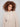 Cozy heather sesame sweater showcasing intricate cable detail and hem slit for added style by Charlie B.
