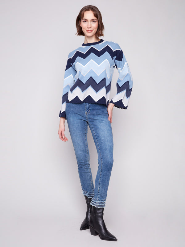 Stylish bell sleeves enhance this blue chevron patterned sweater, perfect for any occasion by Charlie B.