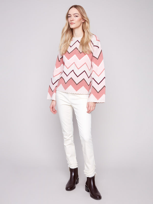 Chevron patterned sweater featuring elegant bell sleeves for a trendy and comfortable style by Charlie B.