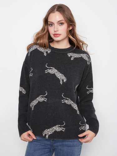 Black sweater with wildcat pattern and ribbed cuffs, featuring a stylish design by Charlie B.